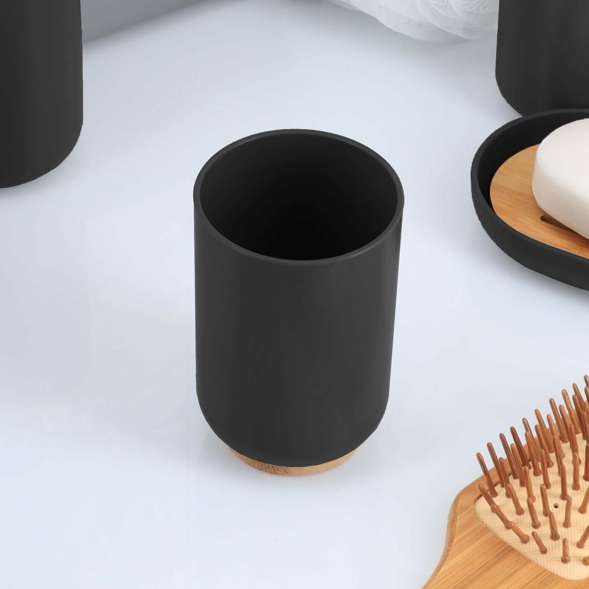 Black bamboo base tumbler on white surface
