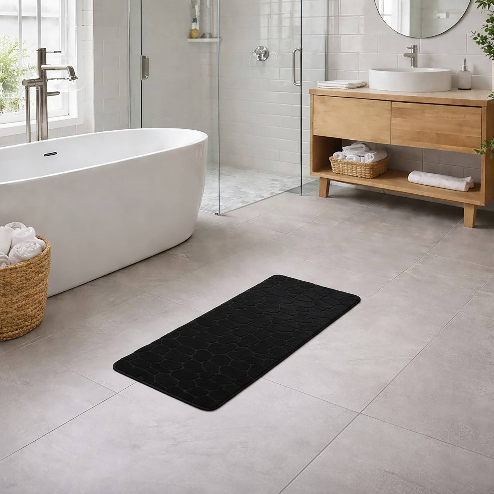 Black memory foam runner mat placed beside bathtub