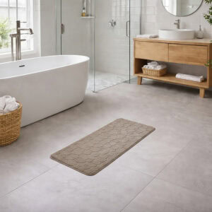 Taupe memory foam runner mat placed beside bathtub