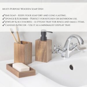 A soap dish used for soap, sponges, jewelry, and candles, placed on a bathroom sink.