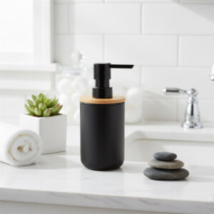Black bamboo soap dispenser styled on bathroom countertop