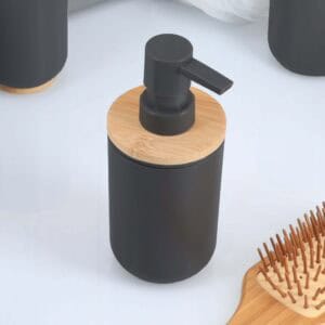 Black soap dispenser with bamboo lid on white surface