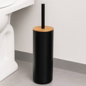 Matte black toilet brush holder with bamboo lid beside white toilet on gray floor