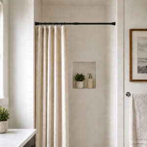 Matte black tension shower curtain rod installed in small bathroom shower alcove with white subway tile and beige curtain