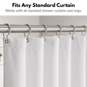 Standard chrome curtain rings and a white shower curtain hanging on a brushed stainless steel shower rod