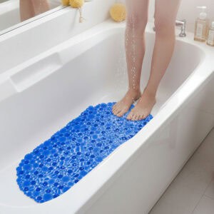 Navy blue pebbles bathtub mat in white tub