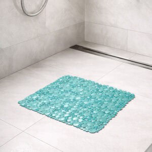 Aqua blue bubble-pattern shower mat on tile shower floor