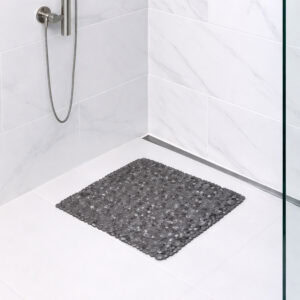 Gray bubble-pattern shower mat on tile shower floor