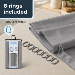 8 gray C-shaped shower curtain rings beside a folded gray polyester curtain and its retail package