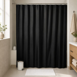 Black polyester shower curtain installed across a bathtub in a hotel style bathroom