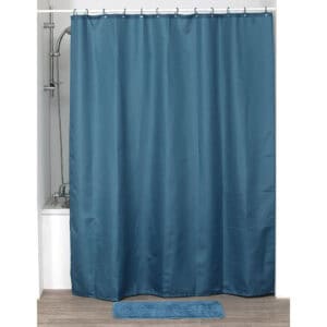 Tahitian blue shower curtain displayed in bathtub setup with matching mat