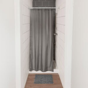 Grey stall shower curtain installed in small tiled shower space