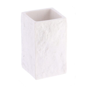 A close-up view of a white bathroom tumbler with a stone-effect texture, showcasing its minimalist rectangular design.