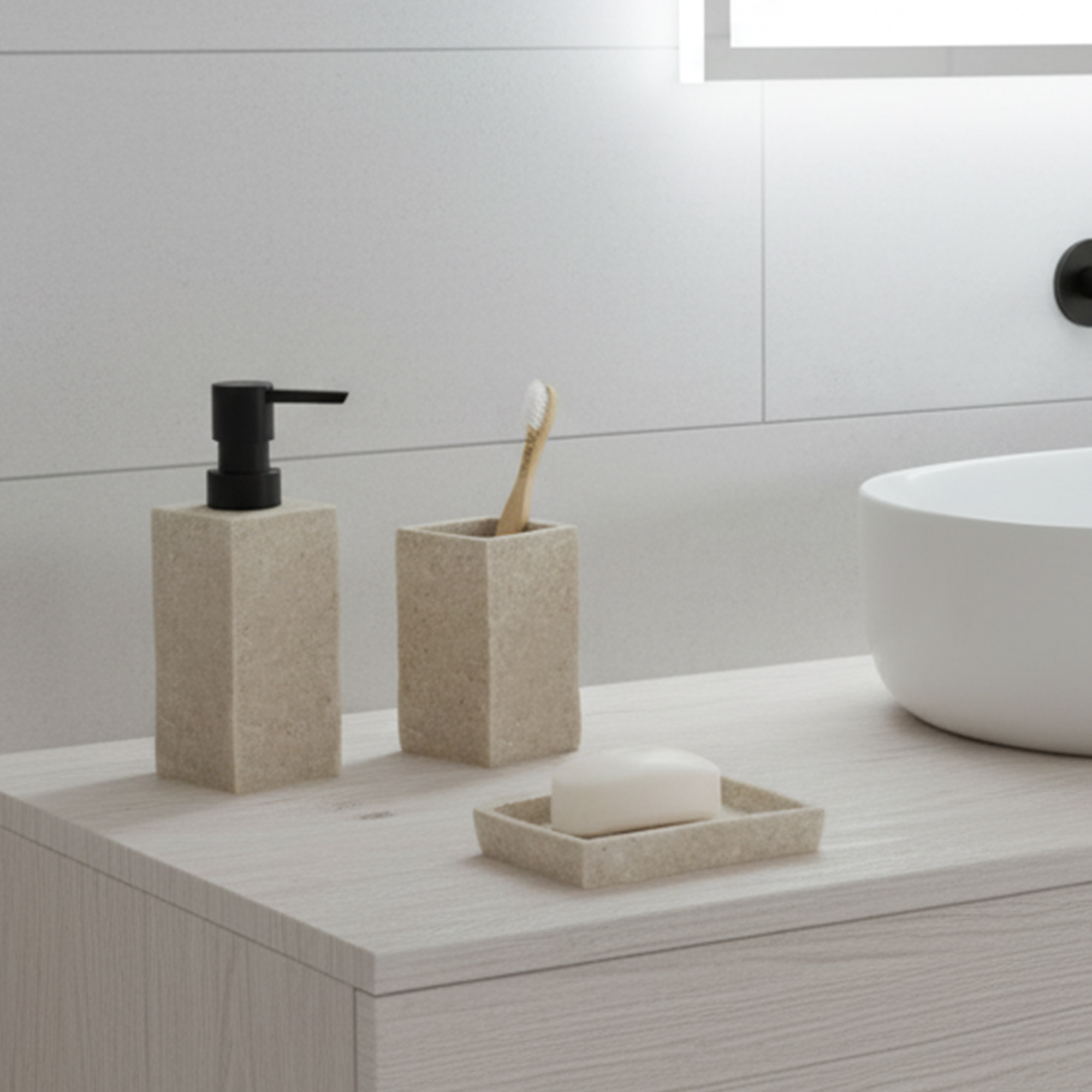 Natural stone effect soap dispenser with dark pump displayed near sink and towels