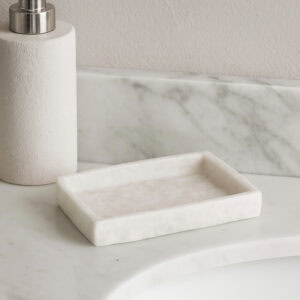 White stone effect rectangular soap dish on marble bathroom counter