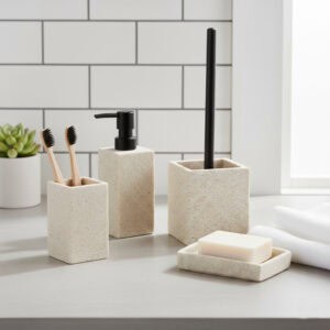 Natural stone effect bathroom accessories including soap dispenser tumbler soap dish and toothbrushes on vanity