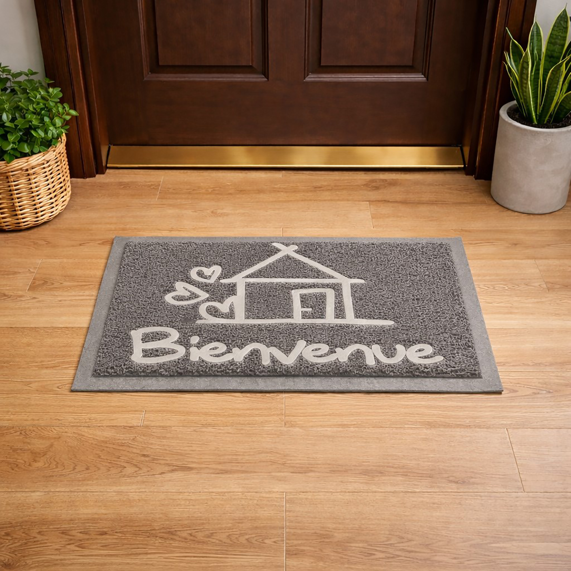 Lifestyle view of gray Bienvenue door mat placed in front of wooden entry door