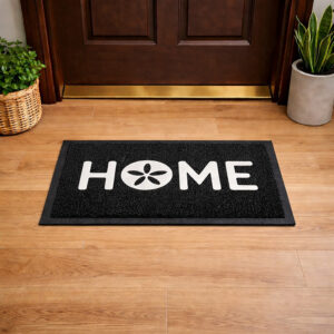 Lifestyle view of black HOME door mat placed in front of wooden entry door