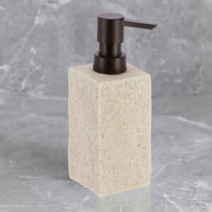 A natural stone-effect soap dispenser with a black pump, set against a textured marble background for a modern aesthetic.