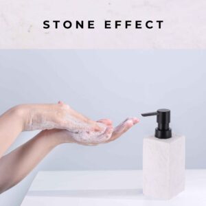 A demonstration of handwashing with soap lather, accompanied by a white stone-effect soap dispenser featuring a black pump on a clean countertop.