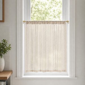 Gold cafe rod with linen tier curtain in bright kitchen window