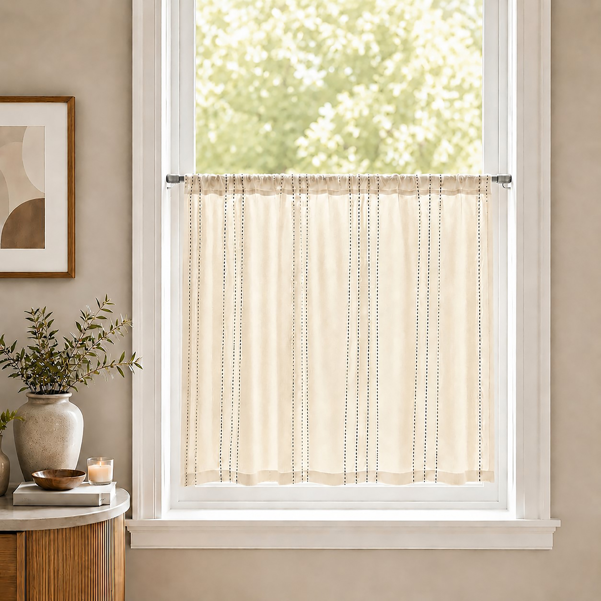 Small kitchen window featuring a sheer off-white curtain with thin vertical stripes mounted on a silver cafe rod.