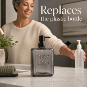 Woman replacing a plastic hand soap bottle with the smoked glass Pure Soap dispenser on a vanity