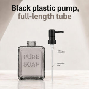 Black plastic pump with full-length translucent tube beside the open smoked glass soap bottle