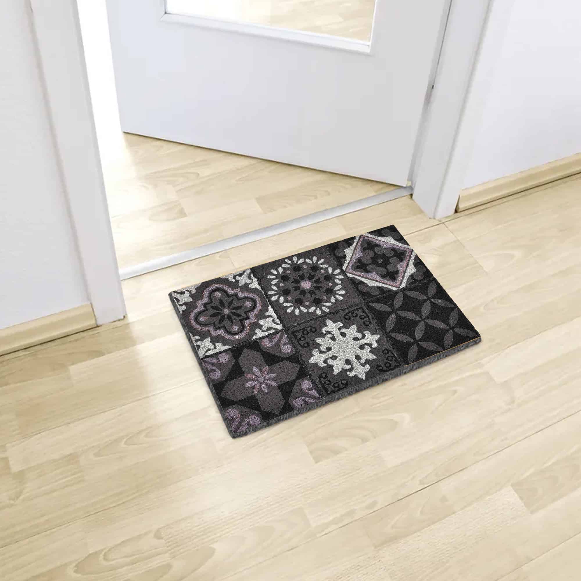 printed coco mat on the floor in front of inside door