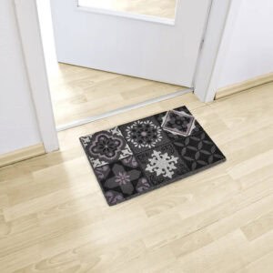 Patterned cement-tile doormat placed inside entry on light wood flooring