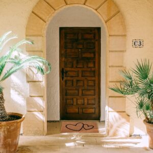 other view of the sheltered door mat outside at entrance door