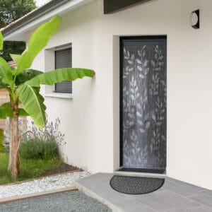Gray half moon doormat placed outside modern front entrance