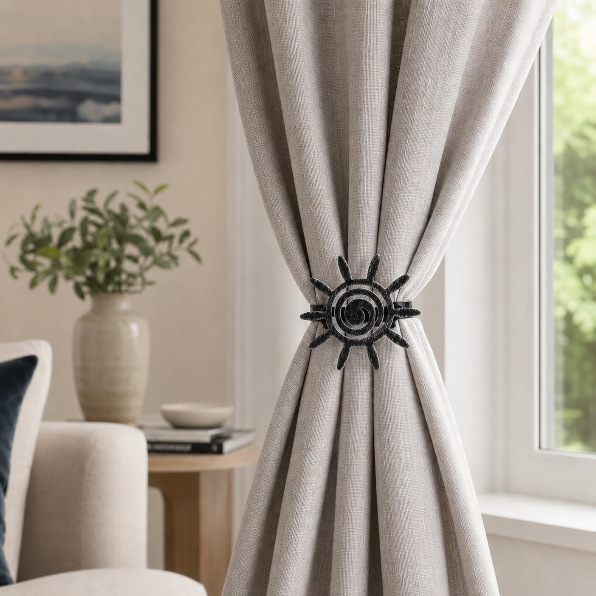 2- Beige linen curtain gathered and held to one side by a black silver sun clip tieback in a bright living room.