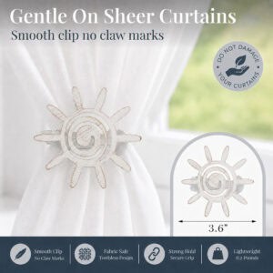 6- White gold sun tieback clipped onto a sheer panel, with icons noting the fabric safe toothless no claw design.