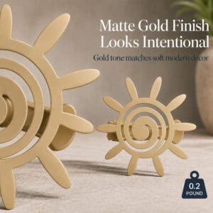 7- Macro view of two matte gold sun tiebacks showing the smooth brushed finish and light weight of zero point two pounds.