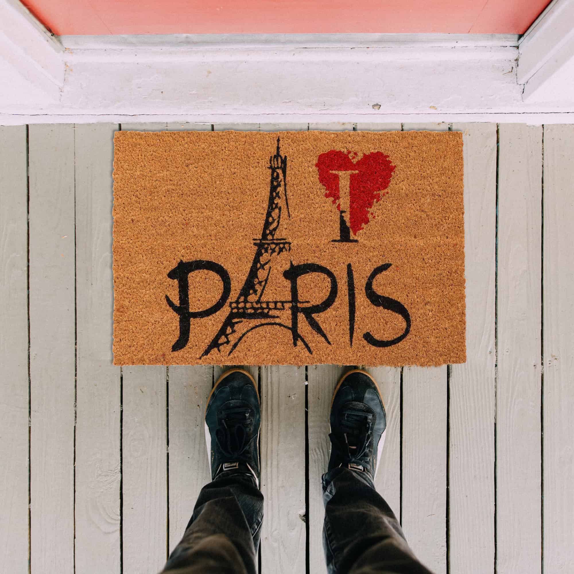 Paris door mat in situation on the floor with man legs and feet