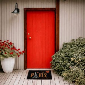 Black Paris doormat top view with person standing