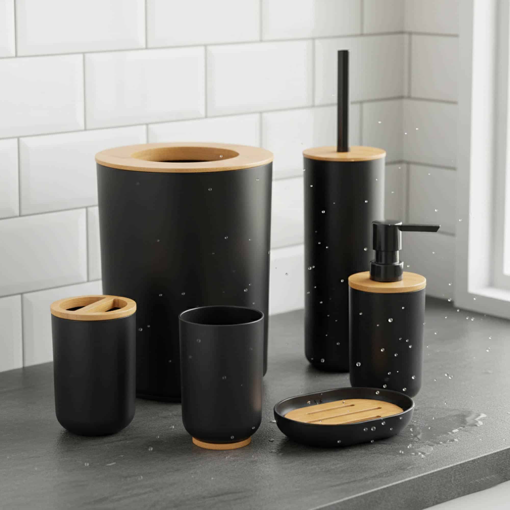 Black bathroom accessory set with bamboo accents on wet countertop