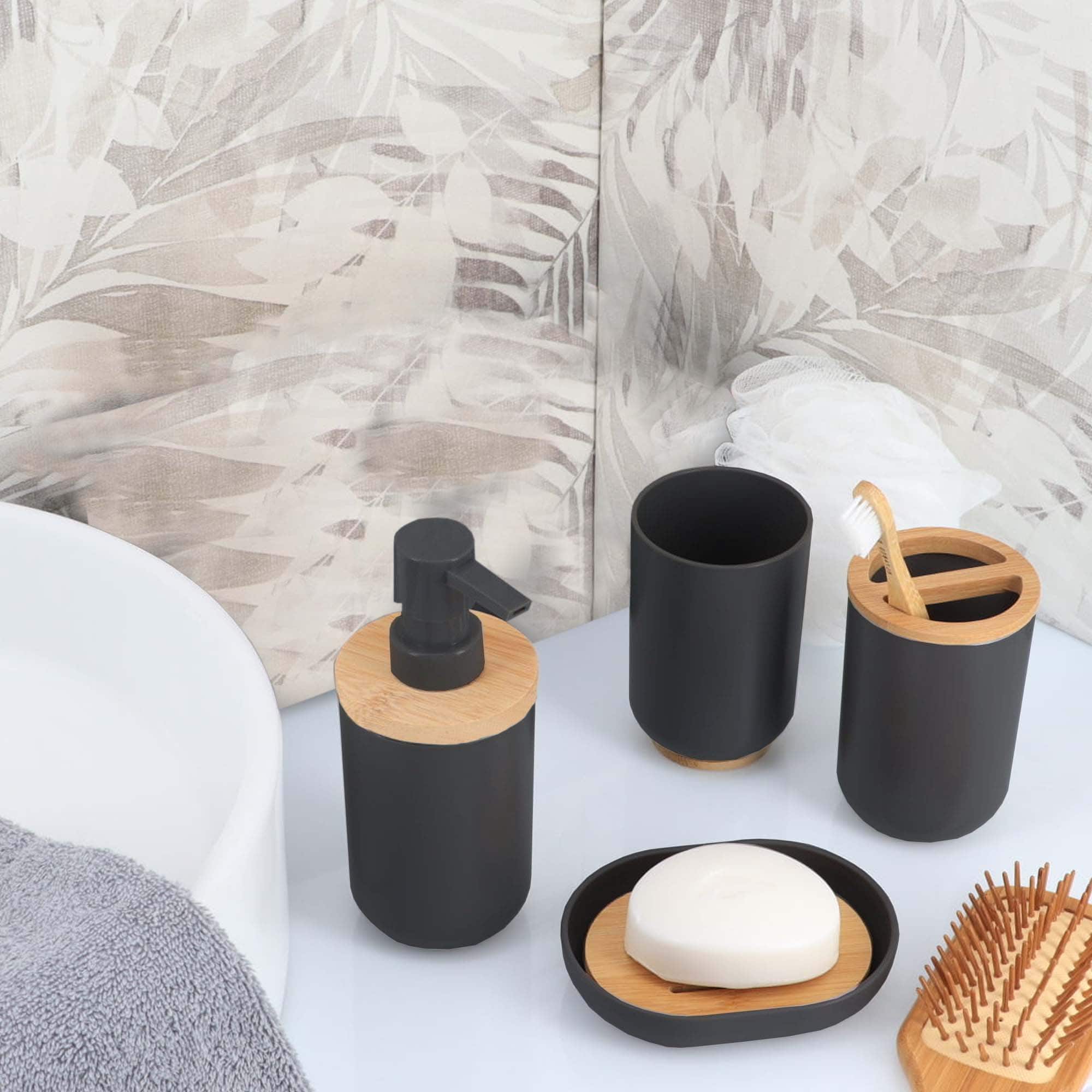 Black bamboo-accent soap dispenser, tumbler, toothbrush holder, and dish on vanity