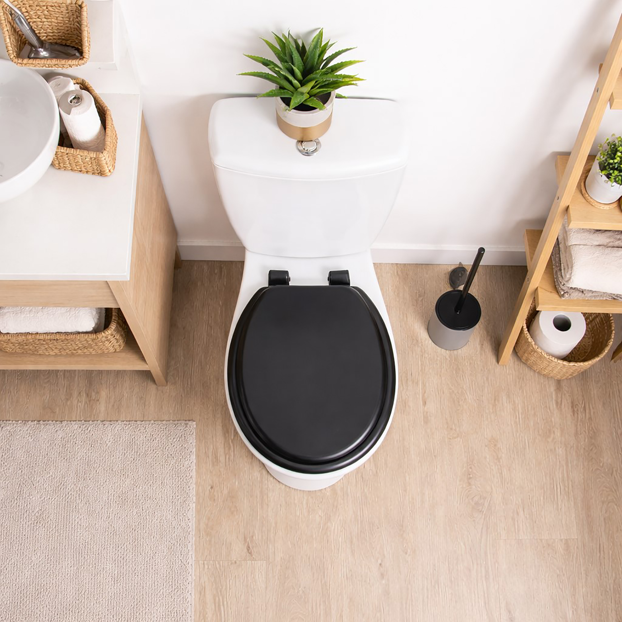 Black round toilet seat installed on toilet top view