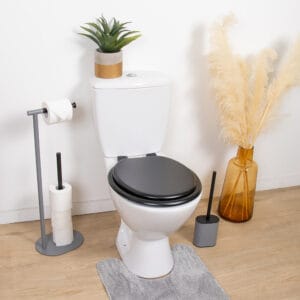 Black round toilet seat installed in modern bathroom setting