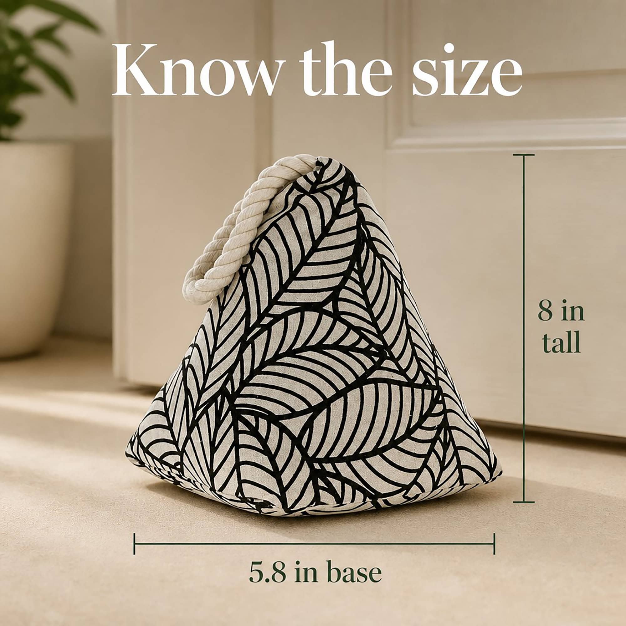 Black leaf print cone door stopper on the floor with measurement callouts. On-image text: "Know the size," "8 in tall," "5.8 in base."