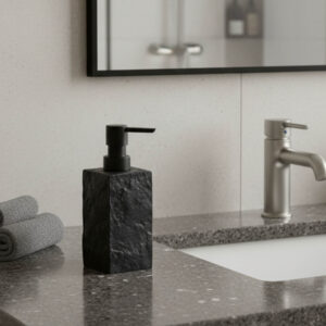 Black stone effect soap dispenser with black pump on bathroom sink countertop