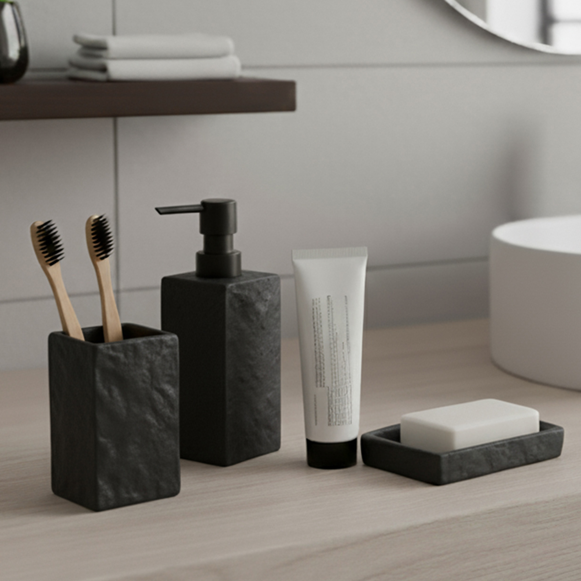 Black stone effect soap dispenser with black pump displayed near sink and towels