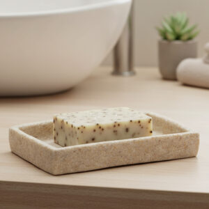Natural stone effect soap dish holding bar soap on vanity