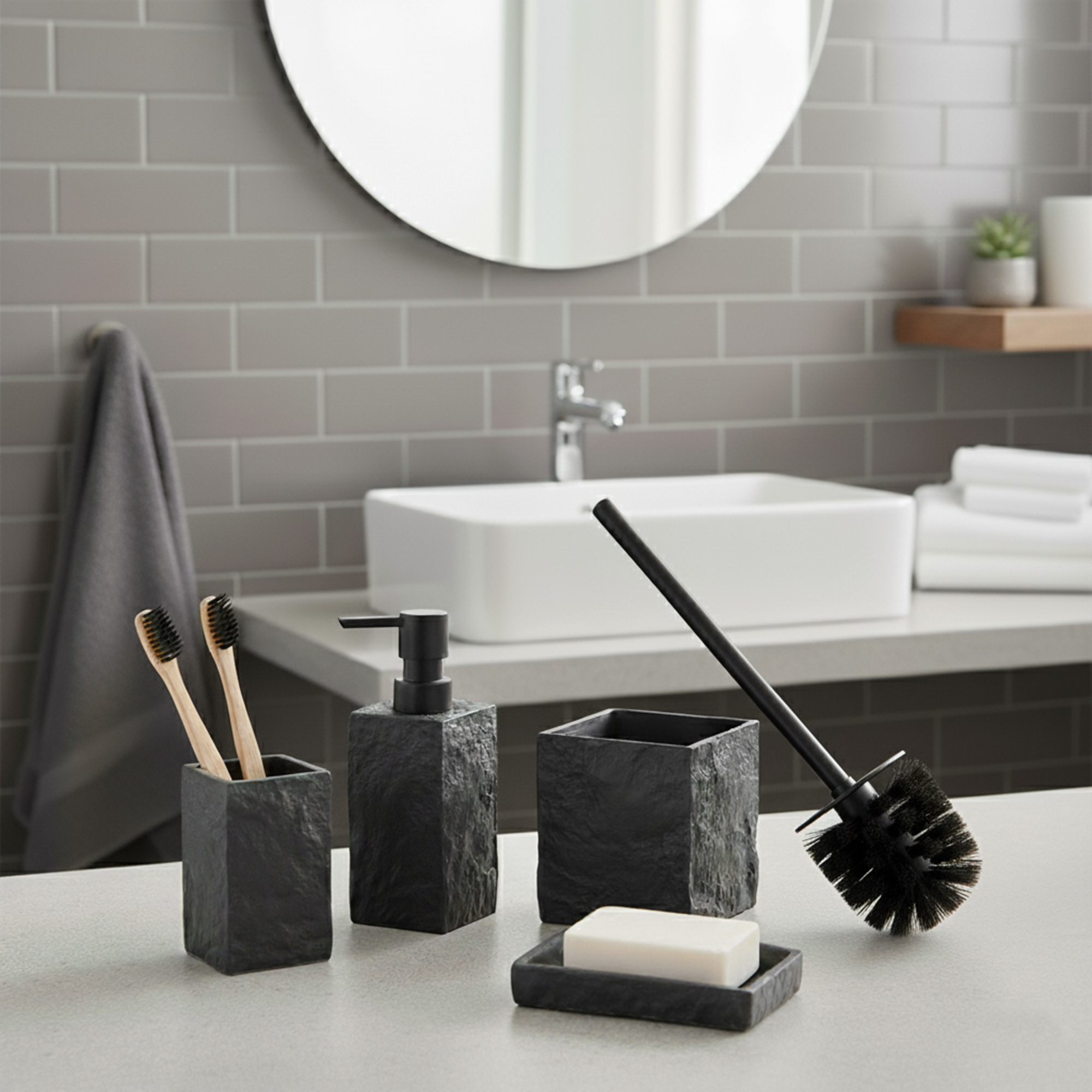 Black stone effect bathroom accessory set with soap dispenser, tumbler, soap dish, and toilet brush