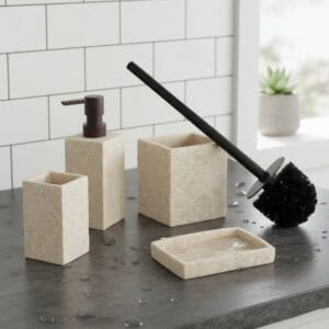 Beige stone-effect 4-piece bathroom set with black brush handle, dispenser, tumbler, and soap dish with water drops