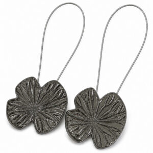 Hero: Set of 2 polished graphite water lily magnetic curtain tiebacks with carved veins on white