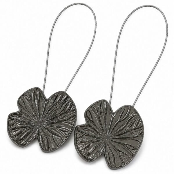 Hero: Set of 2 polished graphite water lily magnetic curtain tiebacks with carved veins on white