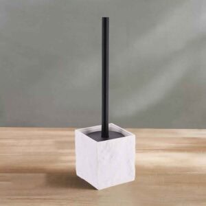 White stone-effect toilet brush holder with black handle on wooden surface